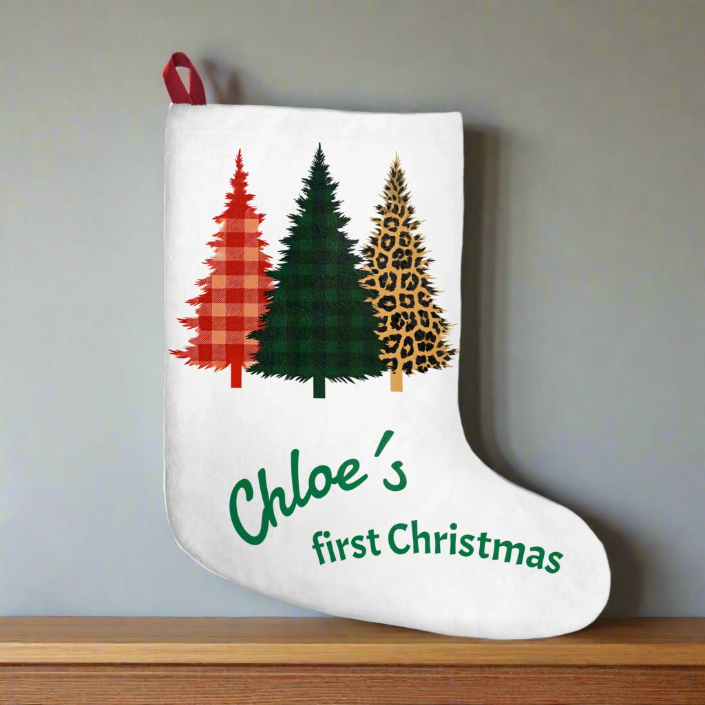 White Christmas stocking with tartan and animal print trees and personalized text on a white background