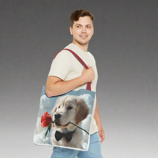 Man holding a tote bag with a dog and rose design with a cloudy sky background