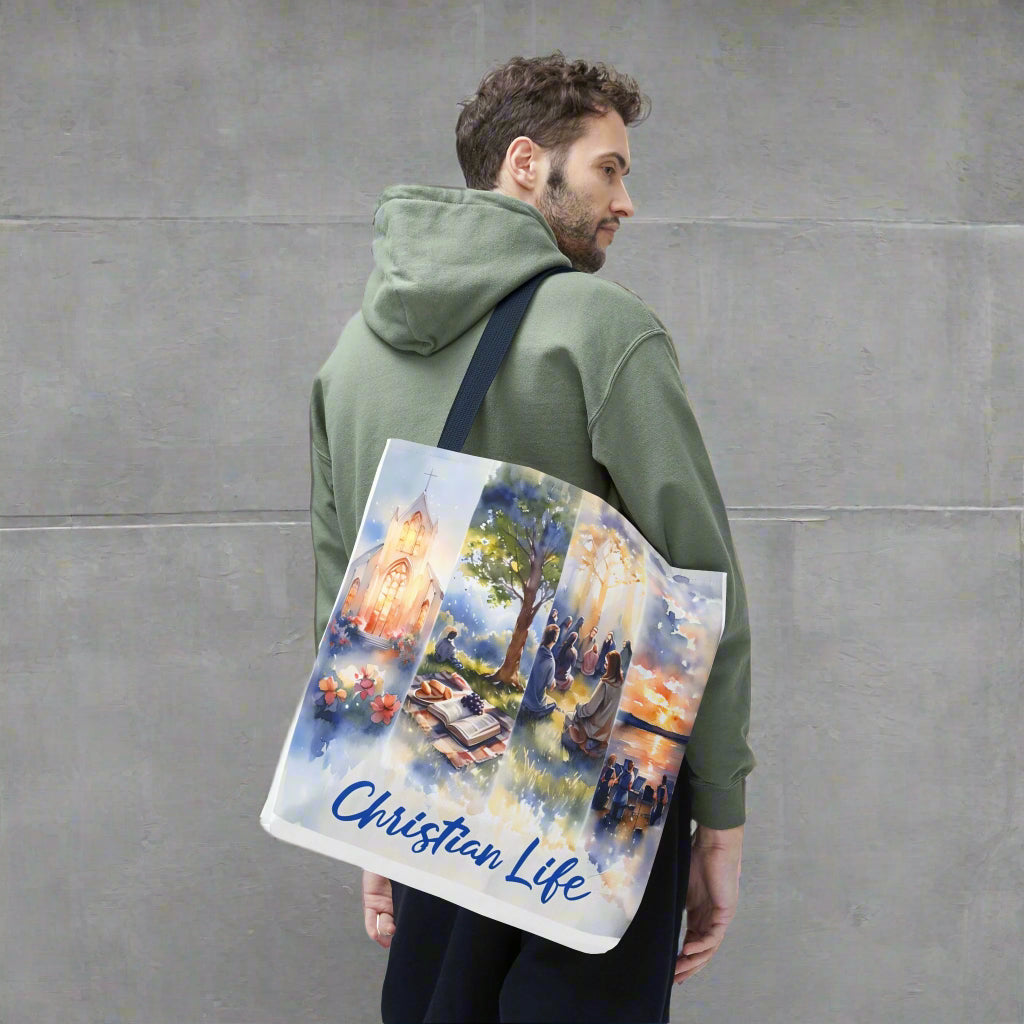 Man holding a tote bag with a 'Christian Life' design in watercolor style