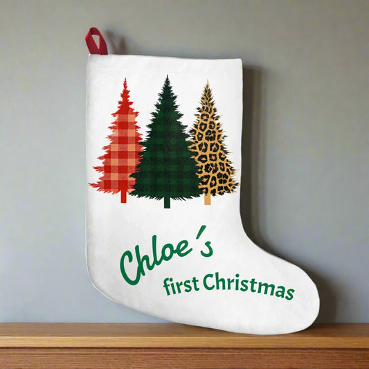 White Christmas stocking with tartan and animal print trees and personalized text on a white background