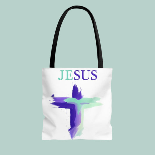 Tote bag with 'JESUS' text and cross design on a white background